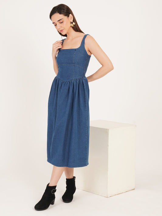 Woman wearing a blue denim dress on birthday party for gorgious look with style boots