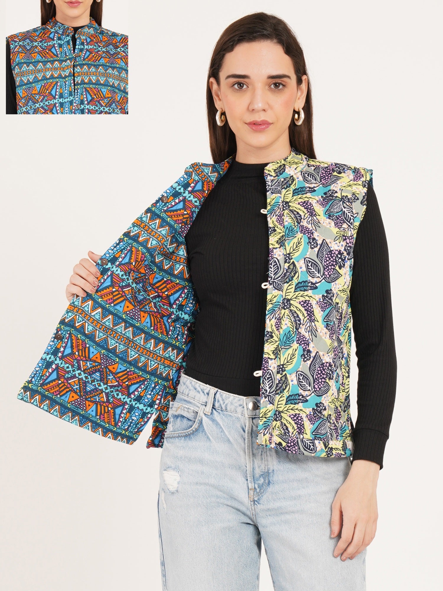 Woman wearing a colorful patterned vest over a black top and light blue jeans, with an inset showing a close-up of the vest.