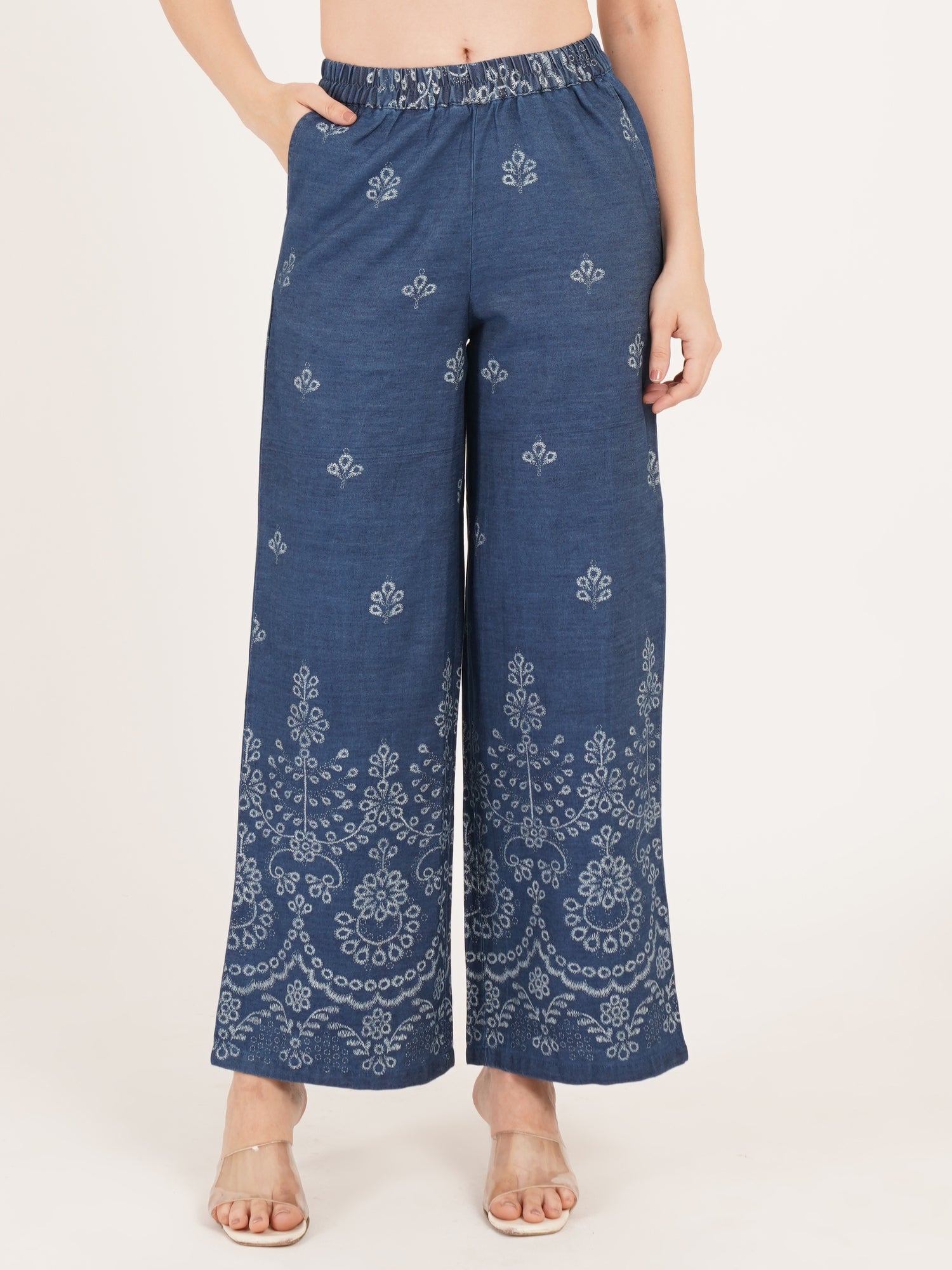 9 Impression Blue patterned pants worn by a person on a white background