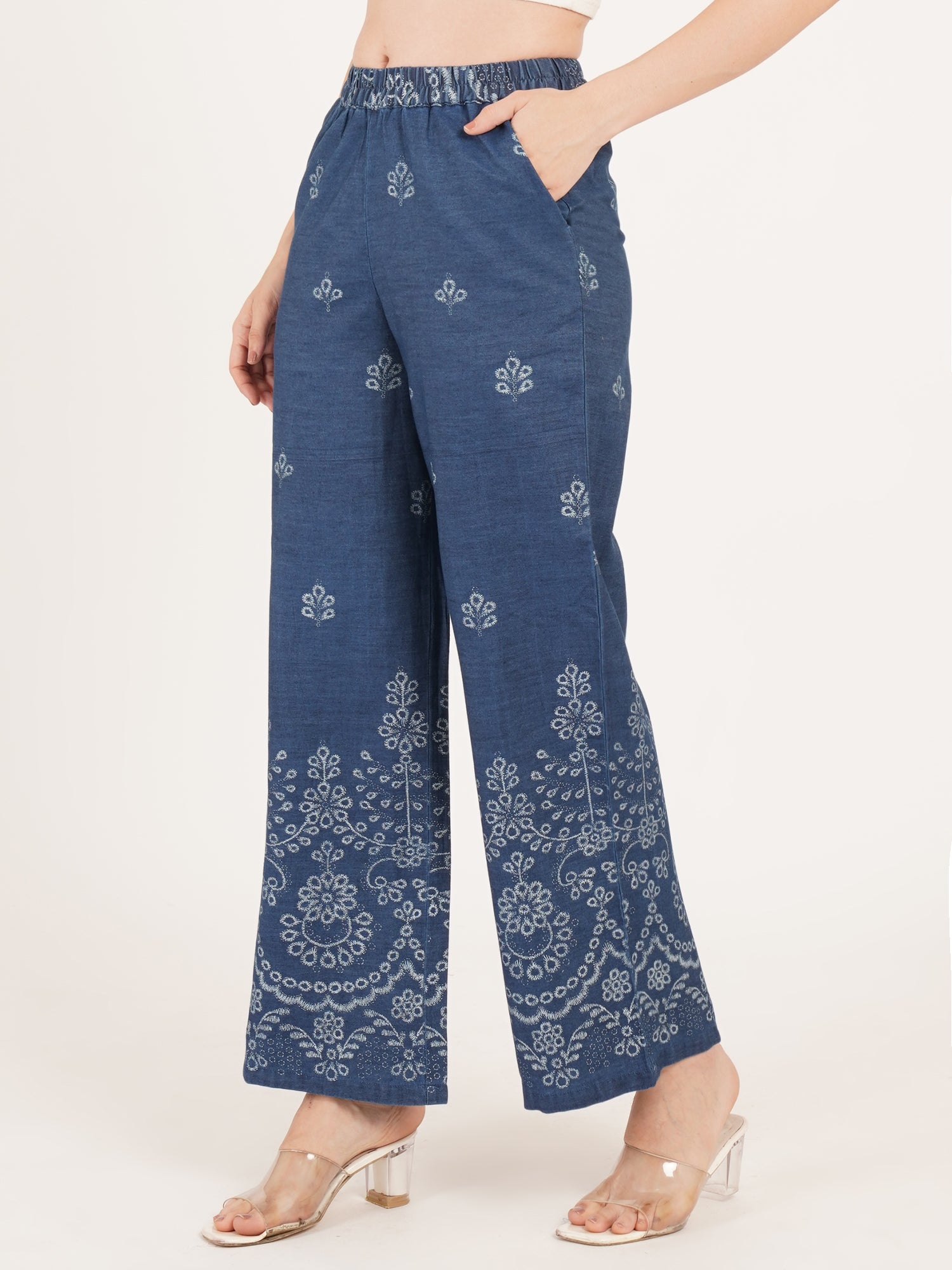 Blue printed palazzo worn by a ladies side view with pocket.